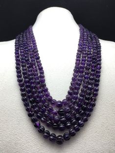 100% Natural Amethyst hand-carved round shape beaded necklace with adjustable silk cord closure Details:- Gemstone: Amethyst Gross weight: 1175.85 carats Net weight: 1151.00 carats Strands: 5 Calibration of beads: from 6.50 millimeters till 10.00 millimeters Length: (Inner) 19 inches (Outer) 22 inches SKU - HJSPSAR0059 100% NATURAL AMETHYST  NOT HEATED NOT TREATED NOT DYED PERFECT HANDCARVED BEADS ROUND SHAPE BEADS ADJUSTABLE SILK CORD CLOSURE UNIQUE NECKLACE AMAZING NECKLACE ATTRACTIVE NECKLACE Thank you for your kind visit to my shop. NOTE: - You will receive the same product you see in the picture.   Dear Buyers, please feel free to ask questions    We will be glad to answer & solve query regarding this product RETURN POLICY: -   Every piece of jewelry and inputs ( gemstones, diamonds, Luxury Purple Jewelry With Round Beads, Traditional Purple Beaded Necklace With Round Beads, Luxury Round Gemstone Beaded Necklaces, Luxury Purple Necklace With Gemstone Beads, Elegant Purple Round Beaded Necklaces, Luxury Beaded Necklaces With Gemstone Beads, Traditional Purple Jewelry With Polished Beads, Amethyst Gemstone Beaded Necklace, Polished Beads For Formal Gems And Cabochons