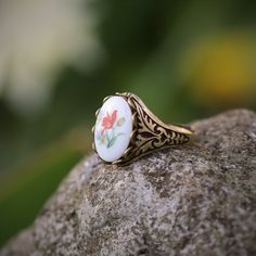 Victorian style German Tulip Cameo. Available on an antiqued brass or silver adjustable vintage style ring. Vintage Bronze Handmade Rings, Vintage Bronze Engraved Ring As Gift, Vintage Bronze Engraved Ring For Gift, Vintage Brass Open Ring Jewelry, Vintage Adjustable Rings For Gifts, Vintage Engraved Flower Ring For Gift, Vintage Engraved Flower Ring Gift, Adjustable Vintage Rings For Gifts, Vintage Adjustable Rings For Gift