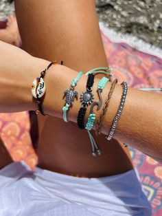 This cute beach bracelet is a delightful accessory that encapsulates the carefree spirit of summer. Featuring an array of small, colorful beads interspersed with charming seashells and ocean-themed charms, this bracelet adds a playful touch to any outfit.  These adjustable design bracelets ensures a comfortable and secure fit for all wrist sizes, making it a versatile accessory for any occasion.  Perfect for adding a coastal flair to your everyday look, these bracelets is a must-have for beach l Multicolor Stackable Jewelry For The Beach, Multicolor Stackable Beach Jewelry, Adjustable Casual Jewelry For Beach Season, Adjustable Coastal Jewelry For Vacation, Adjustable Coastal Style Jewelry For Vacation, Trendy Beaded Bracelets For Beach Festival, Bohemian Adjustable Friendship Bracelets For Beach Season, Adjustable Bohemian Friendship Bracelets For Beach Season, Adjustable Braided Bracelets For Beach Vacation