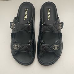 Gorgeous Coveted “Dad” Sandals Purchased At Bal Harbor Chanel Store On 7/5/2024 Worn Only Once And Are Slightly Large So Selling In Hopes Of Finding A Smaller Pair. Wear On Soles - Otherwise Pristine Condition. Just Trying To Make My Money Back (Or Close). Comes With Authenticity Cards/Box/Dust Bags/Receipt. Luxury Slides With Padded Heel, Classic Black Slides With Branded Insole, Classic Black Slides With Rubber Sole, Classic Black Slip-on Slides, Classic Black Flat Slides, Classic Slides With Leather Sole And Round Toe, Luxury Formal Flat Slides, Luxury Slides With Rubber Sole And Round Toe, Classic Black Slides With Flat Heel