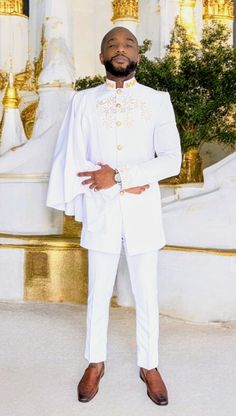 **Introducing the "Taharqa" Slim-Fit Long-Sleeve White African Suit with Gold Embroidery by Dupsie's African Fashion** Experience the elegance of African fashion with the "Taharqa" African suit, a stunning creation by Dupsie's African Fashion. This slim-fit long-sleeve suit is a perfect fusion of contemporary style and traditional African clothing, designed to make a bold statement at any African wedding or cultural gathering. This exquisite white African suit features intricate gold embroidery Elegant Gold Long Sleeve Agbada, Elegant White Long Sleeve Agbada, African Male Suits, African Dashiki Shirt, African Tops For Women, African Pants, Dashiki Shirt, African Suit, African Shoes