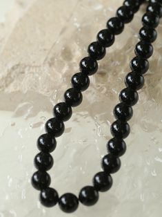 Experience the bold elegance of our "Handwoven Onyx Magnetic Clasp Necklace" – expertly crafted with black onyx stones and a handwoven design, secured by a magnetic clasp. Add a touch of sophistication and mystery to your look with the deep, velvety black stones, while the artisanal touch and convenience of the magnetic clasp make it a unique and effortless accessory. Metal: Recycled Sterling Silver Plated On Brass Gemstone: Black Onyx Necklace Length: 440mm Weight: 83g-88g Black Onyx 8mm Bead Jewelry, Black Onyx 8mm Beads Jewelry, Black Onyx Jewelry With 8mm Beads, Onyx Necklace With 8mm Round Beads, Elegant Black Jewelry With 8mm Beads, Onyx Bead Necklaces With 8mm Round Beads, Onyx Bead Necklace With 8mm Round Beads, Black Onyx Round Beaded Necklaces, Formal Onyx Round Bead Necklaces