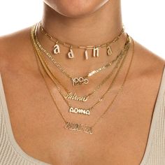 Let the carefree side of your personal style shine bright in Adina's Solid Bubble Name Link Necklace, featuring a cute bubble-font nameplate that dangles from a delicate chain. Customize this gem with the wording of your choice. Pair it with an initial necklace and a couple of cute chokers for a chic, layered look. Product Details Made from Sterling Silver Gold Plated Nameplate Height: 7 MM Chain Thickness: 2 MM Length: 15" +2.5" Capitalized Font This Product Requires 12-18 Business Days To be P Cute Chokers, Bubble Font, Nameplate Necklace Silver, Silver Link Necklace, Nameplate Necklace, Delicate Chain, Graffiti Styles, Letter Charms, Personalized Necklace