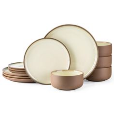 a set of four brown and white dishes