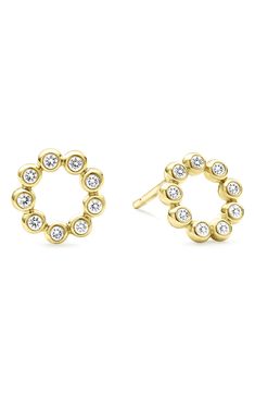 Alluring bezel-set diamonds illuminate these petite round stud earrings handcrafted in 18-karat gold. 1/4" diameter Total diamond weight: 0.18ct. Color: G-H Clarity: SI-1 18k gold/diamond Imported >Diamond Guide Yellow Gold Round Earrings With Bezel Setting, 14k Gold Round Bezel Set Earrings, Round Diamond Earrings With Bezel Setting, Yellow Gold Cubic Zirconia Earrings With Bezel Setting, Yellow Gold Diamond Earrings With Bezel Setting, Gold Diamond Earrings With Bezel Setting, Gold Round Cut Diamond Earrings With Bezel Setting, 14k Gold Round Single Cut Diamond Earrings, 14k Gold Round Diamond Earrings With Single Cut