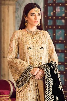 Glamorous Eid Dresses With Zari Work, Glamorous Festive Dresses With Dabka Work, Semi-stitched Gold Anarkali Set With Intricate Embroidery, Designer Gold Anarkali Set With Embroidery, Gold Semi-stitched Anarkali Set With Intricate Embroidery, Gold Anarkali Set For Festive Party Wear, Elegant Gold Sharara With Gold Embroidery, Elegant Gold Embroidered Sharara, Glamorous Eid Dress With Dupatta