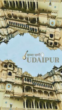 the reflection of an old building in a mirror with words udaipurr written on it