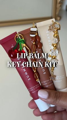 Lip Balm Key Chain Kit! You will receive: -key clasp and ring -2 ring links - 2ft of elastic thread -20-25 smaller beads  -Main Charm depending on which set you choose! (Cherry, strawberry cake, diamond stars, coffee cup) *LIP BALM NOT INCLUDED* *hole puncher also not included! Please use a thumbtack or safety pin to make the hole in the lip balm* Lip Balm Sets, Things To Make Your Friends For Christmas, Lip Balm Organization, Charms On Lip Gloss, How To Get Smaller Lips, Laneige Lip Balm Keychain, Summer Fridays Lip Balm Keychain, Stuff To Get Your Mom For Christmas, Lip Gloss With Charms