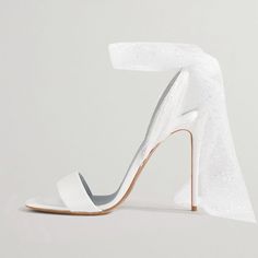 These elegant open-toe sandals are the ideal wedding shoe, bringing a touch of grace and refinement to your special day. Crafted from luxurious satin for a soft sheen, they feature a stiletto heel that elongates your silhouette with style. The open-toe design gives your feet some breathing room, while offering a chic peek of your pedicure. The shoes' secure strap ensures a comfortable fit, allowing you to enjoy your event carefree. Perfect for brides or simply for those desiring a touch of elega High Heel Satin Sandals For Wedding, Wedding Heels With Heel Strap In Satin, Satin Open Heel Wedding Sandals, Wedding Satin Sandals With Open Heel, Satin Heels With Heel Strap For Wedding, Satin Open Heel Sandals For Wedding, Wedding Heels With Heel Strap And Single Toe Strap, Elegant Single Toe Strap Heels For Wedding, Elegant Single Toe Strap Sandals For Wedding