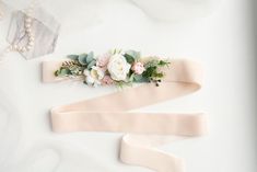 "Blush flower belt Floral belt for the dress Blush wedding belt Bridal flower belt Bridal flower sash Wedding flower belt Wedding sash belt NOTICE! All orders are make at a time as the orders come. If you have a wedding soon, or you need an order for a specific date.Please contact me before place an order.For specification of time of delivery. To avoid difficult situations A beautiful hand made blush velvet belt with artifical flowers and artifical greens. Velor ribbon is also available in other colors - contact me before order! The belt is made by hand. All the branches are gently assembled into a single so that you can enjoy using it.   The velour ribbon is 4 cm (1.5 in ) wide and 2 meters long (78.7 in) The length of the floral part of the belt is 20 cm (7.8 in) Size of haircomb: Length Embroidered Bridal Belt For Wedding, Floral Wedding Belts, Pink Bridal Belt With Sashes For Party, Pink Sashes Bridal Belt For Wedding, Elegant Bridal Belt With Handmade Flowers, Bridal Jewerly, Wedding Hair Pins Crystal, Pastel Pink Weddings, Rose Gold Hair Vine