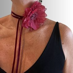 Turn heads with this gorgeous vintage flower choker. The petals are made of organza and lace with filaments embellished with glitter on a luxurious velvet ribbon. The ribbon bow tails are extra long so they can be adjusted to your desired length. One size fits all! Can be worn as a choker, corsage or belt. Available in indigo or crimson red. Ribbon is 151cm/20inches long Flower diameter is 11.5cm/4.5" These are from a vintage lot of flowers so there is only one available in each colour making them truly unique. Red Flower Choker, Neck Flower Choker, Neck Corsage, Victorian Choker, Denim Choker, Rose Accessories, Victorian Style Jewelry, Floral Choker, Bow Choker