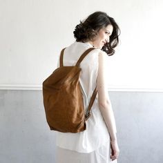 A chic backpack in a compact silhouette made of rich soft nappa leather in a ginger Brown color. complete with subtly edgy zip hardware. with fitted shoulder straps, it serves as an ideal companion for adventures. It is fully lined with black strong cotton fabric with a separate department secures your iPad or other tech, while the deep interior organizes your books, papers or weekend gear, Two small exterior sides pockets provide place for keys, change and etc. ► Antique Gold hardware.► Lined w Brown Leather Backpack Purse, Leather School Backpack, Backpack College, Chic Backpack, Laptop Backpack Women, Large Leather Bag, Handmade Backpacks, Cosplay Kawaii, Leather Laptop Backpack