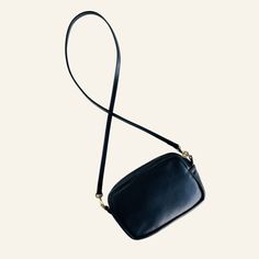 Lux is the perfect accessory for sophisticated style and convenience. This handcrafted leather crossbody bag is both soft and structured, allowing it to maintain its shape as you go from day to night. The rectangular design provides ample space to store your phone, keys, wallet, sunglasses, and a small snack. The 1/2" leather cross-body strap has hand painted finished edges and high quality brass components, detachable and can be swapped out to create a whole new look. Shop our strap section her Classic Crossbody Phone Bag For On-the-go, Leather Clutch Phone Bag For On-the-go, Chic Soft Leather Phone Bag For Everyday Use, Chic Leather Phone Bag For Everyday Use, Soft Leather Phone Bag For On-the-go, Everyday Soft Leather Crossbody Phone Bag, Chic Leather Phone Bag With Removable Pouch, Elegant Everyday Phone Bag In Soft Leather, Chic Soft Leather Phone Bag For Travel