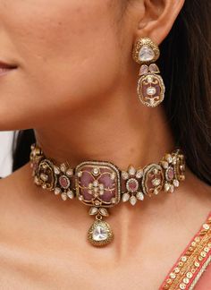 Pretty fine Victorian Kundan choker with pink/Red colored stones and Kundan and Zirconia Necklace with matching earrings The Necklace has adjustable Dori.  The Earrings Have Pushbacks  Highest quality and craftsmanship. Arrives in a box Please let me know if you have any questions Customized orders takes 3 to 4 weeks, depending on piece requirements.  The Ombre Designs Jewelry pieces can be customized in accordance with your requirement.  Please Email or Whats app on : +91 8448833193 / sonalikamehra@theombredesigns.com Pink Choker Necklace Indian, Ceremonial Pink Hand Set Jewelry, Traditional Pink Jewelry For Ceremonial Occasions, Pink Temple Jewelry For Ceremonial Occasions, Pink Ceremonial Temple Jewelry, Ceremonial Pink Kundan Jewelry, Pink Jewelry For Ceremonial Festivals, Pink Jewelry For Ceremonial Festival Occasions, Pink Kundan Necklace For Ceremonial Occasions