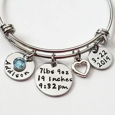 Free Shipping on orders $35 and over. Item Features: 1 - Stainless Steel Adjustable Bangle 1 - Date Charm 1 - Personalized name charm (you choose the name) 1 - Birthstone crystal (you choose the month) 1 - Birth Stats Charm 1 - Silver heart charm Bracelet will come packaged in a pretty organza pouch ready for gift giving. We cannot stamp on the backs of any of our hand stamped items.  To see more Bracelets for Mom click the link below: https://www.etsy.com/listing/598641237/baby-name-bracelet-mom-bracelet-birthday?ref=shop_home_active_10&frs=1 https://www.etsy.com/listing/222557249/baby-name-bracelet-new-mom-gift-new-baby?ga_search_query=your%2Bfirst%2Bbreath&ref=shop_items_search_1&frs=1 https://www.etsy.com/listing/399828117/new-mom-gift-push-gift-personalized?ga_search_query=your%2Bfirs Hypoallergenic Charm Bracelet For Birthday, Adjustable Charm Bracelet For Birthdays, Adjustable Round Charm Bracelet For Birthday, Adjustable Charm Bracelets For Birthday, Adjustable Hypoallergenic Charm Bracelet For Birthday, Adjustable Name Bracelet With Charms For Birthday, Adjustable Charm Bracelet For Birthday And Mother's Day, Nickel-free Charm Bracelet For Birthday And Mother's Day, Adjustable Hypoallergenic Charm Bracelet For Birthdays