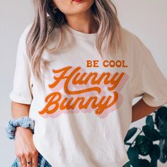 Hunny Bunny Shirt, Be Cool Hunny Bunny Easter Shirt, Retro Easter Tee, Hippie, Boho, Easter Vibes, Easter Gifts, Christian Easter, Plus Size - Etsy Casual Tops With Funny Text For Spring, Retro Slogan Shirt For Spring, Cute Spring Tops With Funny Text, Cute Spring Shirt With Funny Text, Cute Shirt With Funny Text For Spring, White Tops With Funny Text For Spring, White Top With Funny Text For Spring, Spring Graphic Tee Shirt With Funny Text, Spring Cotton Shirt With Funny Text