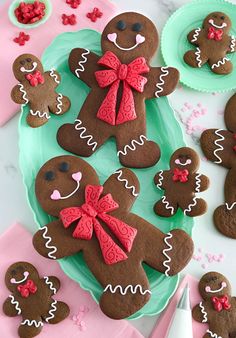 there are many decorated ginger cookies on the plate