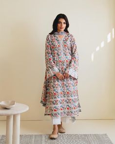 "Introducing vibrant and fashionable printed cambric shirt with dupatta perfect for adding a touch of elegance and style to your wardrobe. Made from high-quality cambric fabric, this shirt offers comfort and breathability, making it an ideal choice. Length : 45\" Dupatta Fabric : Chiffon  Pants Fabric : Printed Cambric" Unstitched Cambric Lawn Suit With Digital Print, Block Print Mulmul Lawn Suit For Eid, Eid Lawn Suit With Block Print In Mulmul, Unstitched Patterned Lawn Suit, Eid Kurta With Printed Motifs In Cambric, Eid Printed Cambric Lawn Suit, Eid Cambric Kurta With Printed Motifs, Festive Floral Print Lawn Suit In Mulmul, Festive Mulmul Lawn Suit With Floral Print