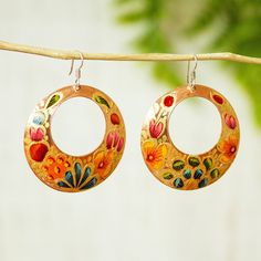 Rosy and Daniel handcraft this bright set of dangle hoop earrings from reclaimed copper. They finish the pair with colorful hand-painted floral designs in gold moss green teal and deep red. Copper Design, Copper Art, Dangle Hoop Earrings, Premium Gift, Enamel Jewelry, Beautiful Wreath, Wedding Things, Moss Green, Floral Designs