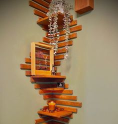 a tall wooden shelf with candles on it