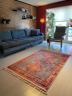 a living room filled with furniture and a large rug