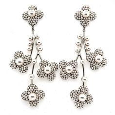 These cherry blossom chandelier earrings have a truly one of a kind motif. Every flower and leaflet cascading down is embedded with elegant studded pearls. This handcrafted pair will make a statement and catch everyone’s eye with their striking design and enchanting presence. -Genuine Crystals and Pearls Approximately 2in from widest point x 4.5in long (5.08cm x 11.43cm) Rhodium plated, non-tarnish finish for brilliance Custom Signature, Luxury Bridal, Bridal Headpieces, Chandelier Earrings, Bridal Style, Trend Setter, Rhodium Plated, Cherry Blossom, Headpiece