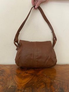 "Vintage Brown Leather purse, shoulder bag, 1970s, slightly distressed, Boho purse, Whiskey brown, Hippie purse Nice solid all leather 1970s brown leather purse Good condition, sound construction some light marks on the back. No damage Flap over closure 3 seperate sections. 1 zippered 1 center 1 large main section Measurements: 9\" x 13\" x 3\" Strap drop: 15\" NK528DR Vintage Brown Leather purse, shoulder bag, 1970s, slightly distressed, Boho purse, Whiskey brown, Hippie purse" Retro Vintage Brown Soft Leather Bag, Vintage Soft Leather Hobo Shoulder Bag, Vintage Soft Leather Hobo Bag, Retro Brown Leather Shoulder Bag, Retro Brown Soft Leather Shoulder Bag, Vintage Brown Leather Hobo Bag, Retro Brown Leather Hobo Bag, Vintage Hobo Bag With Leather Lining, Vintage Leather-lined Hobo Satchel Bag