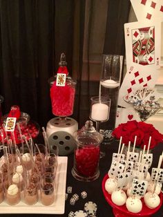 a table topped with lots of desserts and candies