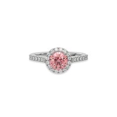 Fancy Pink Round Diamond Halo Engagement Ring is made with a fancy Pink round solitaire diamond set in a four-prong setting, surrounded by a halo of round diamonds all set on a pave band with round cut diamonds.Details: - Made to Order- Focal Diamond Weight: 1.00 CT, 1.25 CT, 1.50 CT, 1.75 CT, 2.00 CT, 2.50 CT, 3.00 CT- Accent Diamond Weight: 0.47 CT - 0.60 CT (Carat weight varies based on chosen Focal Diamond) - Diamond Type: Lab Grown Diamond (CVD, HPHT)- Diamond Cut: Round- Diamond Clarity: V Pink Round Cluster Ring With Halo Setting, Classic Pink Cluster Ring With Halo Setting, Pink Diamond Ring With Halo Design, Pink Cluster Ring With Halo Setting, Pink Diamond Ring With Halo Setting And Round Cut, Pink Diamond Ring With Halo Setting, Rose Gold Round Cut Halo Ring, Rose Gold Halo Ring With Round Cut, Pink Halo Ring With Round Setting