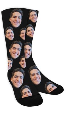 a pair of socks with the face of a smiling man on it, all in black