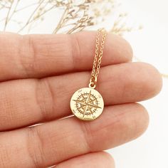 "GOLD COMPASS necklace | Compass Rose Gifts for Travel Lovers | Globetrotter Necklace | Compass Pendant Long distance friendship Going away This gorgeus gold compass necklace is so dainty! has a compass shaped pendant - all made of gold plated over 925 sterling silver. A beautiful, dainty charm that is engraved very clearly. This wonderful sun compass necklace , is perfect to wear as everyday jewelry or for your special moments. You can combine it with other minimalist necklaces to get the perfe Compass Design Pendant Jewelry As Gift, Compass Design Pendant Jewelry Gift, Meaningful Gold Everyday Jewelry, Meaningful Gold Necklaces With Charms, Personalized Meaningful Gold Jewelry, Meaningful Personalized Gold Jewelry, Compass Design Round Jewelry For Gift, Compass Design Round Jewelry Gift, Minimalist Compass Design Jewelry As Gift