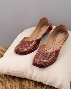 Introducing our "Sepia" Punjabi jutti, a timeless embodiment of elegance and heritage meticulously handcrafted by skilled artisans using pure leather. This exquisite footwear features a warm red-brown hue, beautifully accented with intricate golden jaro work on the upper. Every stitch of the "Sepia" jutti is crafted with precision and care, ensuring impeccable quality and attention to detail. The simplistic yet sweet design highlights the beauty of traditional craftsmanship, making it a versatile and charming addition to any ensemble. Wearing the "Sepia" jutti is like wearing a piece of art that reflects your simplistic personality and love for heritage art. Its understated elegance speaks volumes about your appreciation for tradition and craftsmanship, while its timeless design ensures th Handmade Festive Flats, Traditional Formal Open Toe Sandals, Handmade Festive Flats With Round Toe, Handmade Closed Toe Flats For Festive Season, Festive Leather Closed Toe Flats, Traditional Open Toe Sandals For Formal Occasions, Festive Handmade Flats With Flat Heel, Festive Leather Flats With Flat Heel, Formal Closed Toe Flats For Festivals