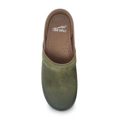 Our flag-bearing Dansko Professional Clog has an iconic silhouette and unbeatable features: a roomy reinforced toe box, an anatomically contoured PU midsole, inner-frame stability, a comfy feet-nestling instep collar, and a supportive heel counter that lets your heel strut around in freedom. Plus, its anti-fatigue rocker bottom will keep you comfortably going forward all day long! Leather and/or fabric uppers Padded instep collar for comfort when walking Roomy reinforced toe box for protection w Backless Shoes, Dansko Clogs, Black Clogs, Garden Clogs, Shoes Stand, Black Oil, Dansko Shoes, Shoe Size Conversion, Professional Women