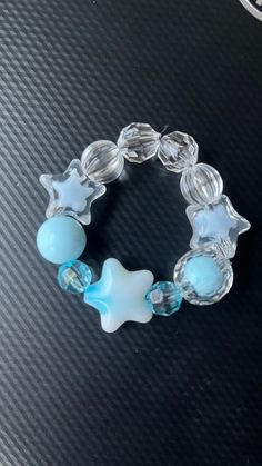 Blue star child size bracelet. Blue Star Charm Bracelet, Blue Handmade Star-shaped Beaded Bracelets, Trendy Blue Star-shaped Jewelry, Trendy Star-shaped Blue Jewelry, Handmade Blue Star-shaped Bracelet, Trendy Blue Star Shaped Jewelry, Handmade Blue Star Bracelet, Star-shaped Adjustable Crystal Bracelet, Blue Bracelet With Star Charm As Gift