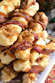 bacon wrapped in puff pastry on a white plate