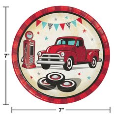 a plate with an old red truck and gas pump painted on it, next to a bunting banner