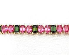 If you love the fun combination of pink and green, this bracelet was meant for you! We have set over 15 carats of gem pink spinel in one bracelet for a luxurious and stunning collection of jewels. These oval spinels are gorgeous, almost electric "holiday" pink, with endless sparkle and life due to their clarity and exceptional brilliance for which spinel is prized. We have set these jewels in 18k rose gold to highlight their spectacular color, alternating with green tourmalines set in 18k yellow Spinel Jewelry, Pink Emerald, Pink Spinel, Jewellery Designs, Green Tourmaline, Yellow Roses, Yellow Rose, 18k Rose Gold, Link Bracelets