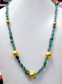 "vintage Designer 22 ct gold and high-quality natural Emerald gemstone beads necklace. Fully handcrafted vintage old 22 ct gold beads strung together with natural Oval shape emerald gemstones beads. Total Length-57 cm(22.44\")we can adjust the length, size of center gold bead-13 mm, Emerald size-12/9 mm, Emerald weight-125 carats, net gold weight approx-5 grams." Antique Gold Polished Beads, Antique Polished Gold Beads, Antique Large Gold Beads, Gold Emerald Necklace With Round Beads And Spiritual Style, Gold Spiritual Emerald Necklace With Round Beads, Antique Gold Beaded Necklaces With Large Beads, Antique Gold Necklace With Large Beads, Artisan Gold Necklace With Polished Beads, Artisan Gold Jewelry With Faceted Beads