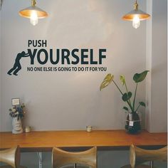 there is a sign on the wall that says push yourself, no one else is going to do it for you