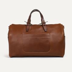 Leather Duffle Bag I Travel bag for Men I Made in France | Bleu de chauffe Rectangular Tan Bags For On-the-go, Luxury Tan Satchel For Travel, Travel Satchel With Luggage Sleeve In Cognac, Classic Travel Accessories With Leather Handles For Daily Use, Classic Cognac Travel Bag, Cognac Travel Bag With Luggage Sleeve, Classic Cognac Travel Bag For Everyday, Brown Travel Accessories With Leather Handles, Brown Travel Accessories With Leather Handles For Everyday