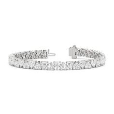 The eternal classic charts a new course with this north-south diamond tennis bracelet. Heart-shaped diamonds secured by v-prongs line up in alternating north-south settings, with the heart's pointed tip alternately pointing up and down. The shift creates a chic and modern appearance while maintaining an air of timelessness. Anniversary Tennis Bracelet With Diamond Accents, Classic Heart Cut Diamond Bracelet For Anniversary, Heart Cut Tennis Bracelet With Diamond Accents For Anniversary, Anniversary Heart Cut Tennis Bracelet With Diamond Accents, Heart Cut Diamond Bracelet In Fine Jewelry Style, Fine Jewelry Heart Cut Diamond Bracelet, Formal Heart Cut Diamond Bracelet, Diamond Tennis Bracelet With Heart Cut For Anniversary, Diamond Heart Cut Tennis Bracelet For Anniversary