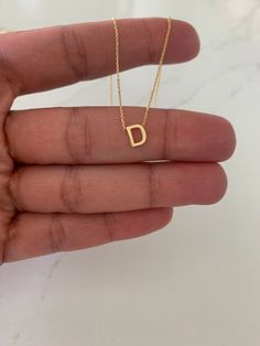 Dainty 14K Gold Initial Necklace, Tiny Gold Initial, Gold Choker, Dainty Initial, Choker, Dainty Gold Chain, Initial Necklace 14K Gold PLEASE SPECIFY YOUR LETTER ON THE NOTES SECTION -----------------------------------------------------------------------------------------------This dainty initial necklace is a beautiful, affordable dainty piece of jewelry that is great for everyday wear. It comes available in any gold color: rose gold, yellow gold or white gold. This necklace can be used in comb Dainty Initial Letter Necklace, Dainty Jewelry Necklace Letter D, Dainty Initial Pendant Necklace, Tarnish Resistant, Elegant Gold Initial Necklace, Adjustable, 14k Gold Initial Pendant Necklace - Gift For Her, 14k Gold Initial Necklace, Dainty Gold Chain, Diy Phone Case Design, Girly Songs