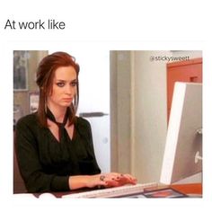 a woman sitting in front of a computer on top of a desk with the caption at work like