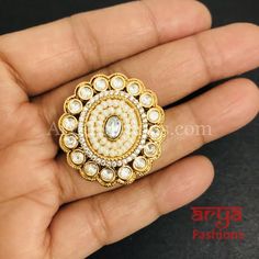 Esha Pearl Kundan Jadau CZ Round Ring Features: Adjustable Kundan Ring to match any finger size 22 Karat Gold Finish Lightweight Jewelry Made in Brass with very high quality Pacchi Kundan and CZ. Suitable for any occasion and traditional or Modern attire Ready to ship and available for local pickup from 23059. Please message us for more details Free shipping on orders above $75 within USA. White Stone Work Wedding Gift, Kundan Toe Ring As Gift, Traditional Hand Set Rings For Marriage, Traditional Hand-set Rings For Marriage, Traditional Rings With Stone Setting For Festivals, Traditional Rings With Stone Setting For Gifts, Temple Jewelry Style Round Rings For Celebrations, Traditional Rings For Festival Celebrations, Traditional Wedding Rings With Stone Work