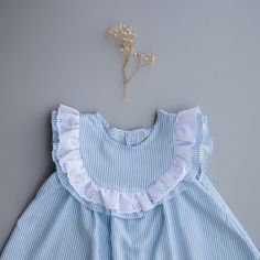 Sizes: 0-3 Month to 8 Years Skill level: IntermediateFormats: A4/Letter, A0, ProjectorFabric: lightweight woven Olena is a sleeveless dress with ruffles at the front extending over shoulders to back, a full button opening at the back, and a gathered seam above a flared skirt. The bodice is unlined with arm and neck openings finished with a single-fold bias tape. Designed to have a regular fit with moderate ease around the chest. Length falls an inch below the knee, the bottom hem is slightly rou Spring Dress-up Dresses With Ruffle Sleeves, Cute Ruffle Hem Dress For The Beach, Cute Ruffle Dress With Ruffle Hem For Beach, Cute Ruffle Hem Dress For Beach, Cute Ruffled Mini Dress For The Beach, Cute Ruffled Mini Dress For Beach, Blue Cotton Dress With Ruffle Sleeves, Daywear Dress With Ruffles And Flutter Sleeves, Cotton Dress With Smocked Back And Ruffled Straps