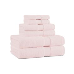 six pink towels stacked on top of each other