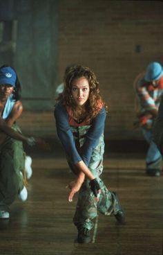 a group of young women dancing in a dance studio