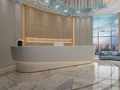 a reception area with marble flooring and chandelier hanging from the ceiling above it