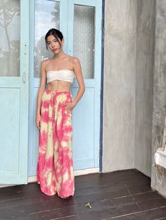 Step into a soft dreamscape of color with our Summer Tie-Dye Wide-Leg Pants. The perfect choice of vacation wear, these flared pants reflect free-spirited chic, letting you float through summer in unconfined comfort. Handcrafted from 100% Rayon, they offer exceptional breathability and a fluidic drape that keeps you cool and light as air all summer. It features an elasticated drawstring waist that offers an adjustable fit and side pockets for a practical flair. The vibrant tie-dye patterns captu Summer Festival Wide-leg Harem Pants, Summer Vacation Wide-leg Harem Pants, Summer Hippie Pants For Vacation, Hippie Summer Pants For Vacation, Summer Hippie Vacation Pants, Hippie Summer Vacation Pants, Summer Vacation Hippie Pants, Summer Vacation Harem Pants, Summer Wide-leg Harem Pants