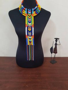 African necklace sets. Perfect for weddings, traditional events , African themed events etc. In this listing you'll get; *3 in 1 multistrand necklace. *long pendant necklace. Custom orders are welcome. More neckleces here; https://www.etsy.com/shop/TribalTess?ref=seller-platform-mcnav&section_id=21306083 Back to my shop; https://www.etsy.com/shop/TribalTess?ref=seller-platform-mcnav Traditional Multicolor Beaded Necklaces As Gift, Traditional Adjustable Necklaces With Colorful Beads, Traditional Necklaces With Colorful Beads And Adjustable Fit, Traditional Adjustable Necklace With Colorful Beads, Beaded Necklaces For Festivals As Gifts, Beaded Necklaces For Festivals And Gifts, Traditional Handmade Long Beaded Necklace, Bohemian Bridal Necklace With Colorful Beads, Traditional Multicolor Necklace For Gifts